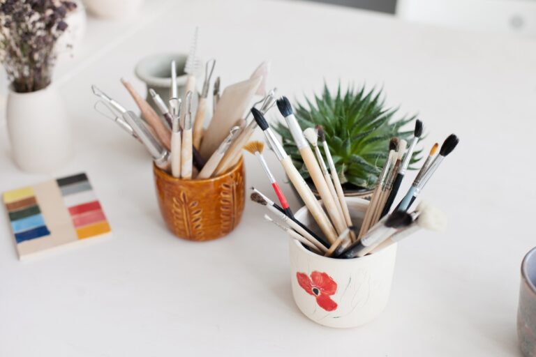 Ceramic and Pottery Tools and brushes on the table at creative studio for clay pottery lessons