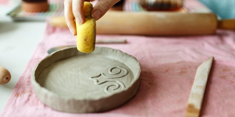 Closeup Image of Female Hands Works with Clay Makes Future Ceramic Plate, Classes of Hand Building