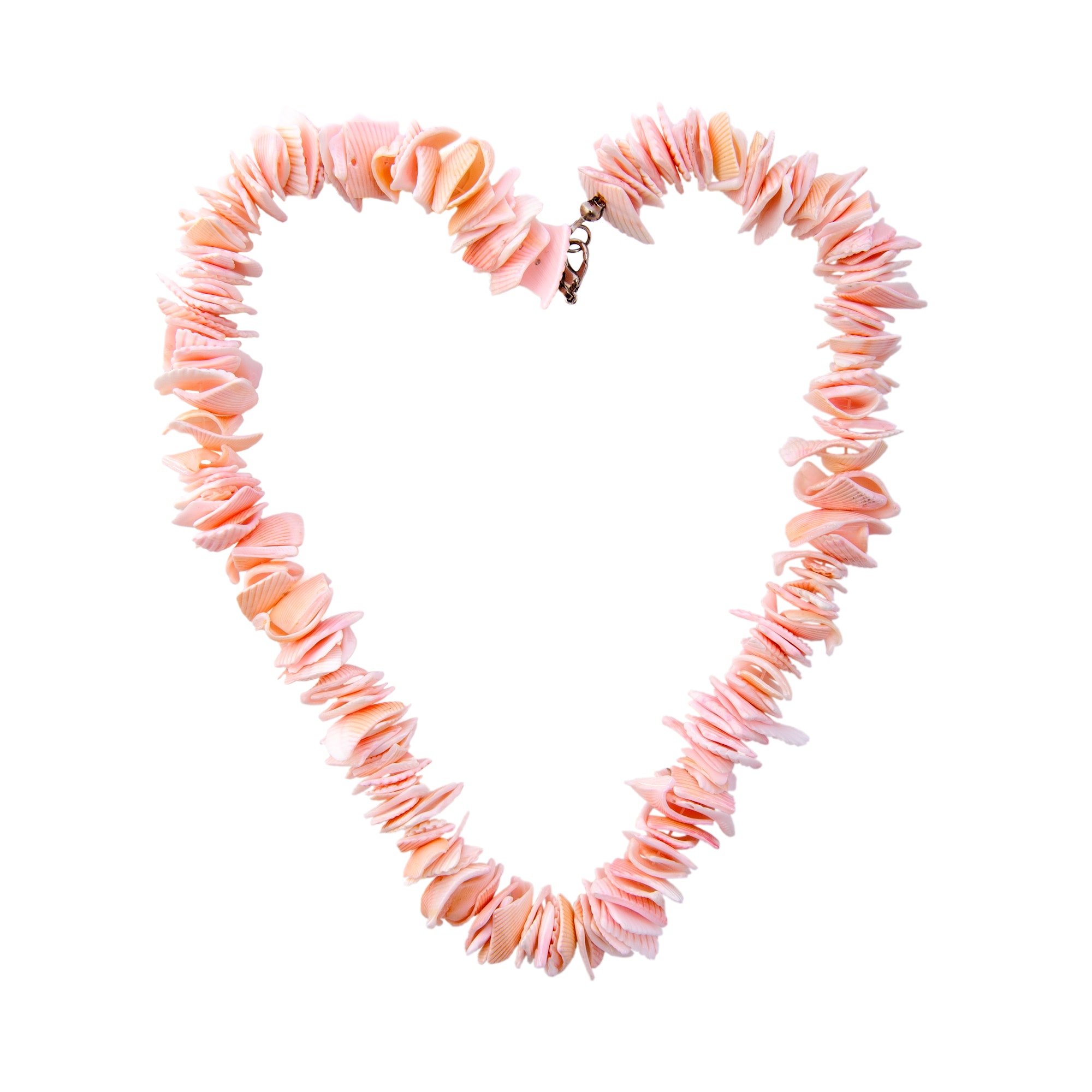 Coral beads in the shape of a heart on a pure white background.